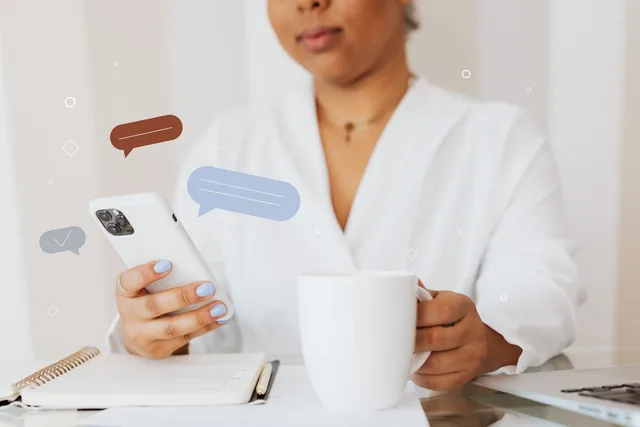 A woman holding a phone and a mug, with illustrated message bubbles above the phone